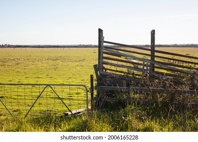 Livestock Farm Fence And Gate Above Low Pastureland In Regional Victoria, Australia.