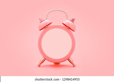 Living Coral Alarm Clock With Empty Face, No Hands, On Trendy Coral Color Background. Minimal Creative Concept. Copy Space.