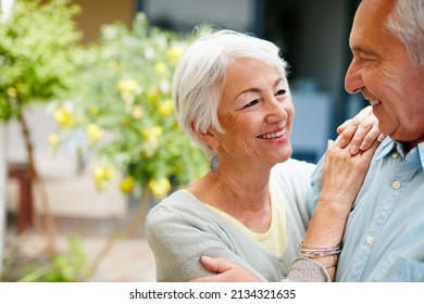 Living The Happiest Days Of Their Love Story. Shot Of A Happy Senior Couple Outdoors.