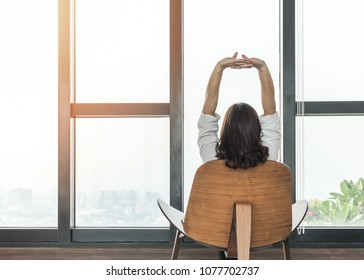 Living lifestyle, luxury simplicity home relaxation life style of happy working woman take it easy sitting resting on comfort chair at home, condominium or city hotel lobby interior with rooftop view - Shutterstock ID 1077702737