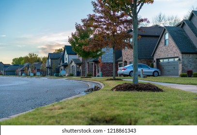 Living in Residential Housing Neighborhood Street at Sunset in Bentonville Arkansas - Powered by Shutterstock