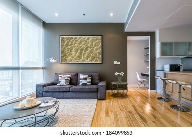 Living Room With Big Window And Brown Wall Interior