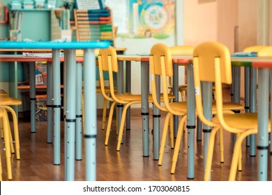 Living room: Chairs, table and toys. Interior of kindergarten. Soft selective focus.