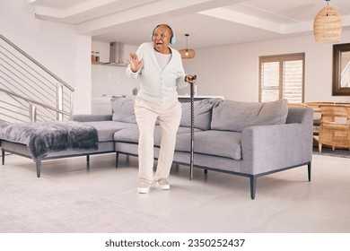 Living room, dancing and happy senior woman with headphones enjoy music and excited for retirement in her home. Happiness, freedom and elderly person listening to radio, audio and song with smile
