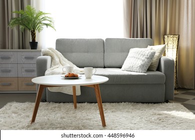 Living room design interior with sofa and round table - Shutterstock ID 448596946