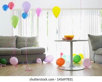 Living Room Full Of Colorful Balloons By Sofa