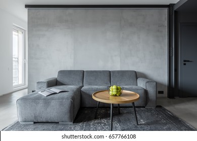 Living room with gray sofa and round coffee table