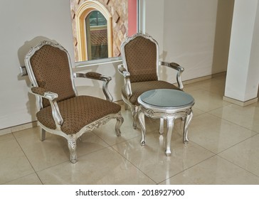 Living Room In A Hallway With Rustic Colonial Furniture In Silver And Brown Colors