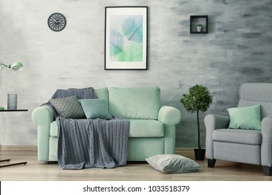Living room interior with comfortable mint couch - Shutterstock ID 1033518379