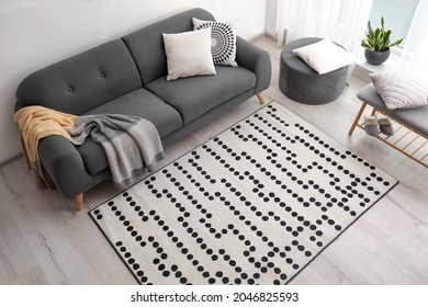 Living room interior with comfortable sofa and stylish rug, above view - Shutterstock ID 2046825593