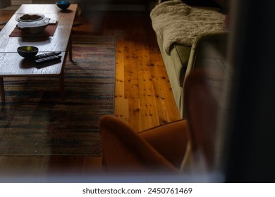 Living room interior cozy home couch soft blankets fireplace hearth wooden mantle objects seen through patio garden glass french doors armchair sofa couch velvet comfy cozy shelves stuff collected - Powered by Shutterstock