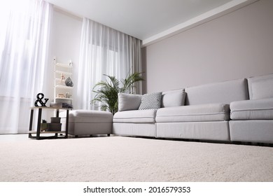 Living room interior with soft carpet and stylish furniture - Shutterstock ID 2016579353