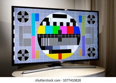 Living room with LCD television displaying multi colored test screen - Powered by Shutterstock