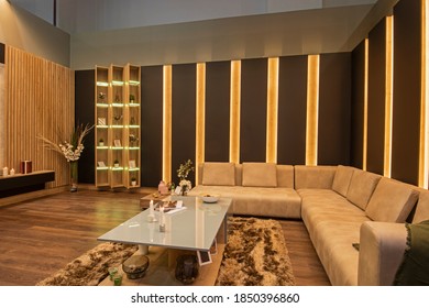 Living room lounge area in luxury apartment show home showing interior design decor furnishing with large sofa