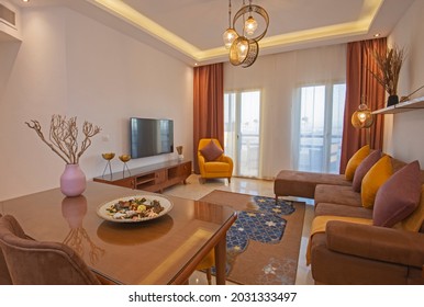 Living Room Lounge Area In Luxury Apartment Show Home Showing Interior Design Decor Furnishing With Balcony Terrace And Dining Table