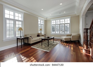 Living Room In Luxury Home With Cherry Wood Flooring