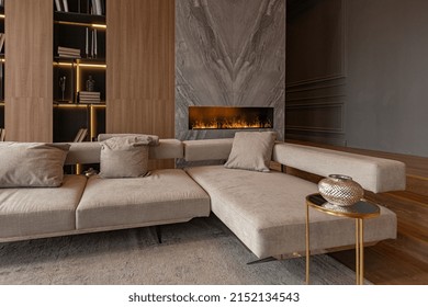 Living Room, Marble Wall Fireplace And Stylish Bookcase To The Ceiling In A Chic Expensive Interior Of A Luxurious Country House With A Modern Design With Wood And Led Light, Gray Furniturу