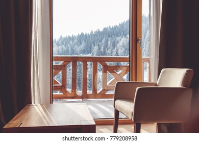 Living Room With View On Snow Covered Mountain.