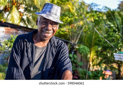 Livingston, Guatemala - March 7, 2015: Garifuna Man Smiles Into The Camera On March 7, 2015 In Livingston, Guatemala. Garifuna Are The Group Of Indigenous People Of African Descent In Central America