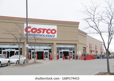 LIVONIA, MI / USA - March 30, 2020: A Line Outside A Costco Warehouse Club In Livonia, MI Where Shoppers Are Limited Inside Due To Social Distancing During The Coronavirus (COVID-19) Global Pandemic.