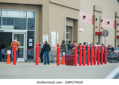 LIVONIA, MI / USA - March 30, 2020: A Line Outside A Costco Warehouse Club In Livonia, MI Where Shoppers Are Limited Inside Due To Social Distancing During The Coronavirus (COVID-19) Global Pandemic.