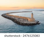 Livorno lighthouse and pier, at the south entrance of the Harbour of Livorno in Tuscany on the Ligurian Sea