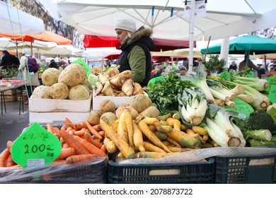 Ljubljana, Slovenia 1.12.2019 Female Farmer Selling Home Grown Vegetables On A Farmers Market