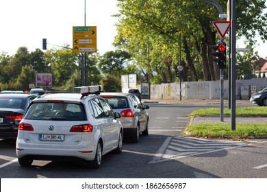 LJUBLJANA, SLOVENIA 11.9.2020. Car With A Home Improvement Materials On The Roof Stopped In The Intersection At The Red Light. Real Traffic In The City.