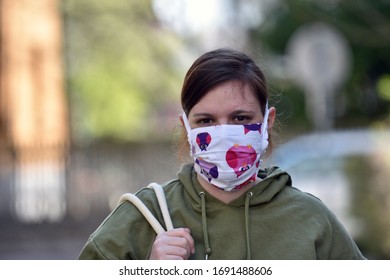 Ljubljana / Slovenia - 4/1/2020: Young woman wearing a DIY facemask for protection against coronavirus.