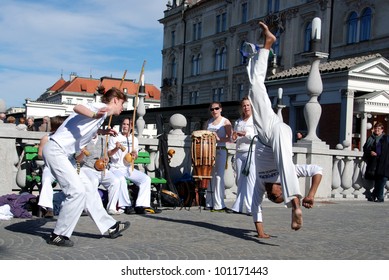 LJUBLJANA; SLOVENIA - APRIL 26: Capoeira tradicao baiana, master Ubaldo Alegria, introduces capoeira at street dancing festival Preserna Ana for World Dance Day on April 26, 2012, in Ljubljana, SI.