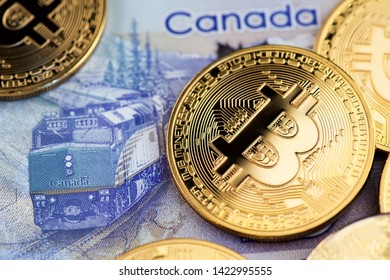 Ljubljana, Slovenia Europe June 2019, Bitcoin Cryptocurrency Coins On Canadian Dollar Bill. Canada Bitcoin Cryptocurrency BTC CAD Money