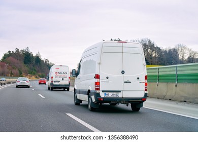 Ljubljana, Slovenia - January 16, 2019: White Minivans In Road. Mini Van Auto Vehicle On Driveway. European Van Transport Logistics Transportation. Auto.