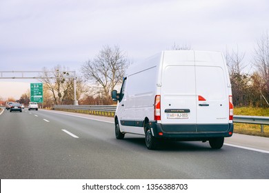 Ljubljana, Slovenia - January 16, 2019: White Minivan On Road. Mini Van Auto Vehicle On Driveway. European Van Transport Logistics Transportation. Auto