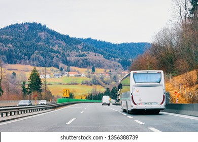 Ljubljana, Slovenia - January 16, 2019: White Touristic Bus In Road. Tour Modern Shuttle Bus Back On Highway. Urban Transport With Driver. Excursion Long Vehicle.