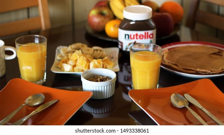 Ljubljana, Slovenia - July, 2019: Breakfast With Pancakes Nutella And Mixed Fruit On The Table
