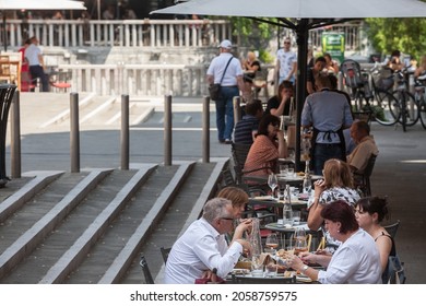 LJUBLJANA, SLOVENIA - JUNE 14, 2021: Packed Patio Of A Restaurant With People Sitting, Eating Out For Lunch Break At Noon, Not Respecting Social Distancing, In The City Center Of Ljubljana.

