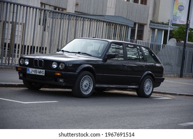 LJUBLJANA, SLOVENIA - MAY 3, 2021: BMW E30 Touring Old Classic German Estate Station Wagon 1980s Car On The City Street