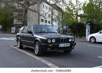 LJUBLJANA, SLOVENIA - MAY 3, 2021: BMW E30 Touring Old Classic German Estate Station Wagon 1980s Car On The City Street