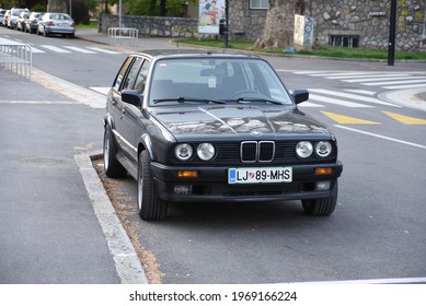 LJUBLJANA, SLOVENIA - MAY 3, 2021: BMW E30 Touring Old Classic German Estate Station Wagon 1980s Car On The City Street