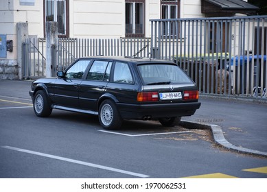 LJUBLJANA, SLOVENIA - MAY 3, 2021: BMW E30 Touring Old Classic German Estate Station Wagon 1980s Car On The City Street