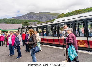 Llanberis, Wales, UK – June 30 2019. Passengers Getting Off The Diesel Train Service At Llanberis Train Station After A Trip To The Summit Of Mount Snowdon On The Mount Snowdon Railway Line