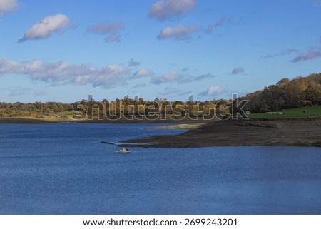 Llandegfedd's dramatically low water level in the designated Site of Special Scientific Interest, highlights ecological concerns for wildfowl overwintering and nesting, in Torfaen, South Wales, UK