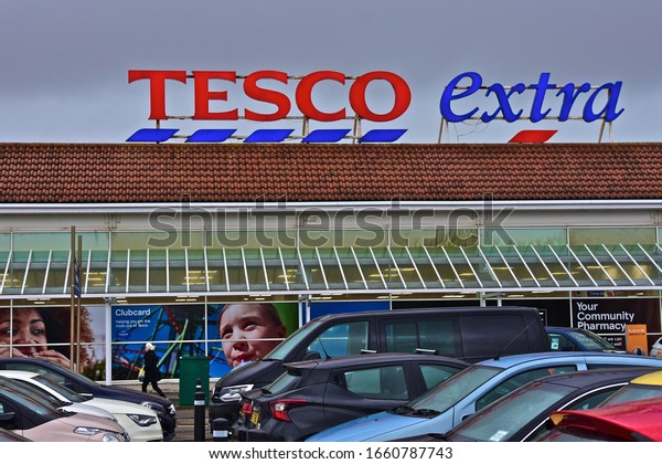 Llanelli, Carmarthenshire / Wales\
UK - 2/22/2020: The sign over the Tesco Extra retail supermarket\
located in Parc Trostre Retail Park on the outskirts of\
Llanelli.