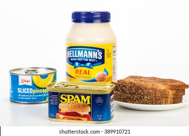 LLANO TX - MAR 9, 2016: Small can of Hormel Foods Spam in foreground with ingredients for Spam and Pineapple Sandwich on neutral background.