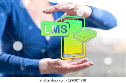 Lms Concept Between Hands Of A Woman In Background