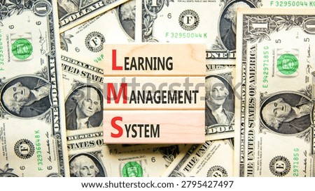 LMS learning management system symbol. Concept words LMS learning management system on beautiful wooden blocks. Beautiful dollar background. Business LMS learning management system concept. Copy space
