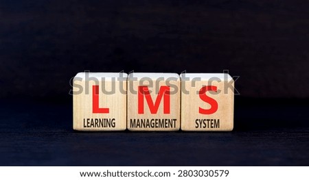 LMS learning management system symbol. Concept words LMS learning management system on beautiful wooden blocks. Beautiful black background. Business LMS learning management system concept. Copy space