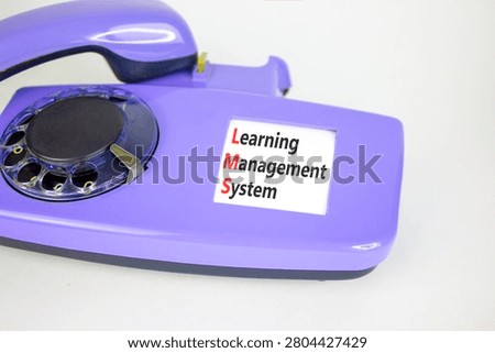 LMS learning management system symbol. Concept words LMS learning management system on beautiful old disk phone. Beautiful white background. Business LMS learning management system concept. Copy space