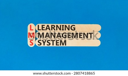 LMS learning management system symbol. Concept words LMS learning management system on beautiful wooden sticks. Beautiful blue background. Business LMS learning management system concept. Copy space