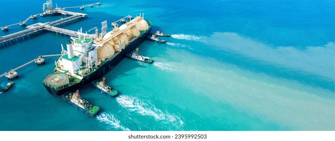 LNG (Liquefied natural gas) tanker anchored in Gas terminal gas tanks for storage. Oil Crude Gas Tanker Ship. LPG at Tanker Bay Petroleum Chemical or Methane freighter export import transportation